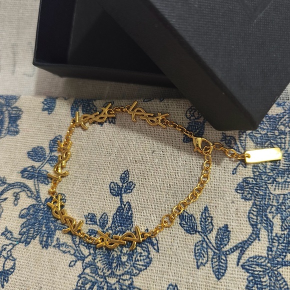 Yves Saint Laurent Jewelry - Yves Saint Laurent Intertwined Logo Gold Chain Bracelet